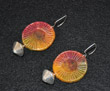 Earings- sunset colors on round wire frames with large decorative silver-toned bead