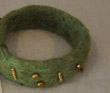 Green bracelet with gold seed bead decoration